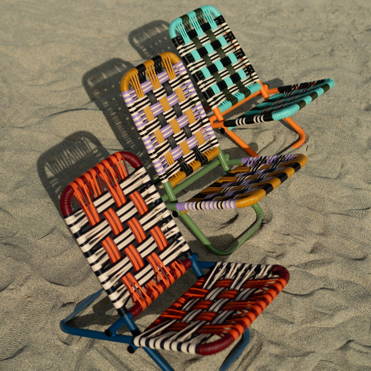 Silla de playa Tucurinca 4200 — las tres versiones juntas en la playa